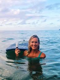 Bethany Hamilton holding Amavara sunscreen